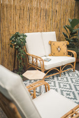 Riviera rattan loveseat, angled view