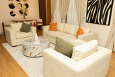 Ivory cloud corner sofa with matching armchairs, room view