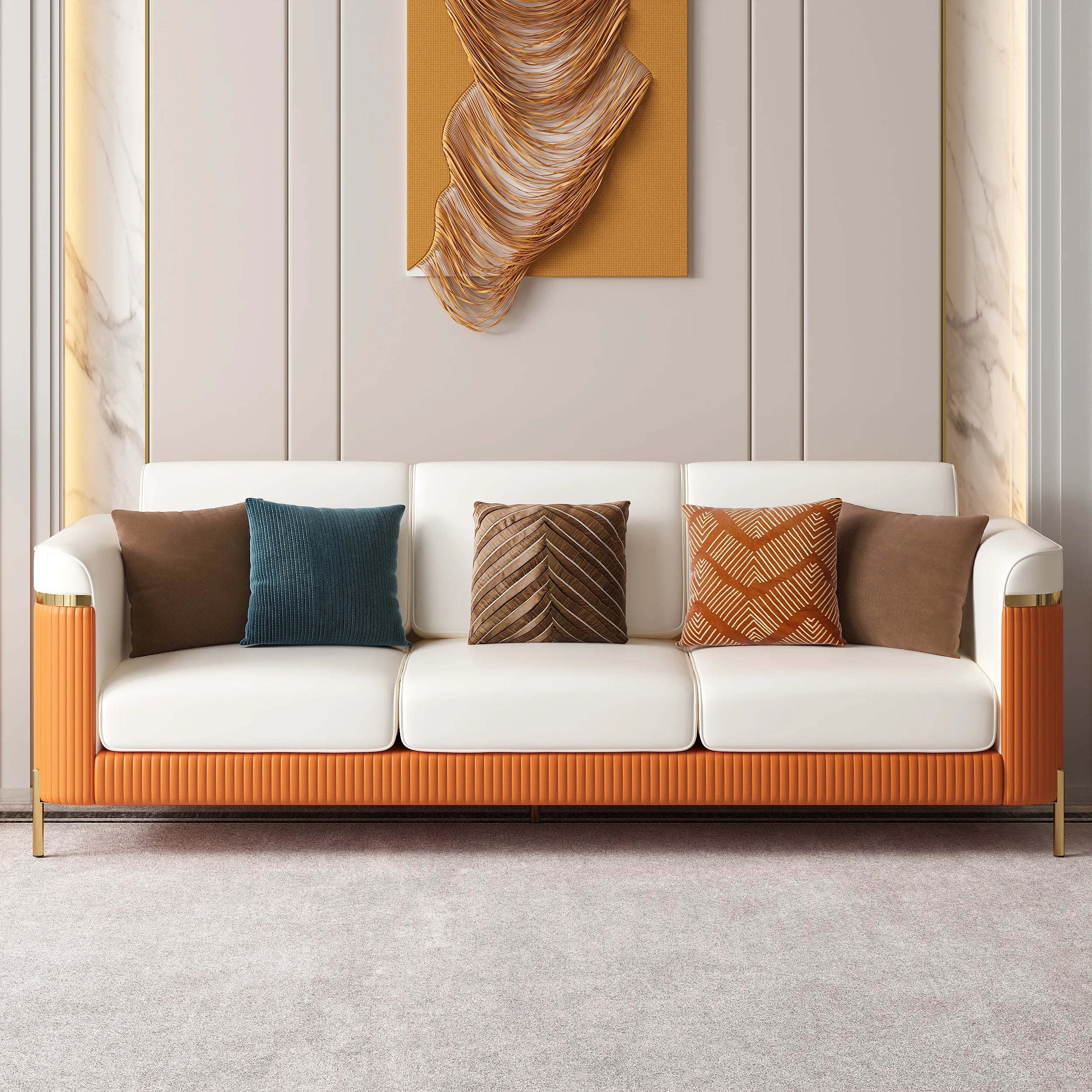 Modern white and orange sofa with patterned cushions against a neutral wall with abstract art.