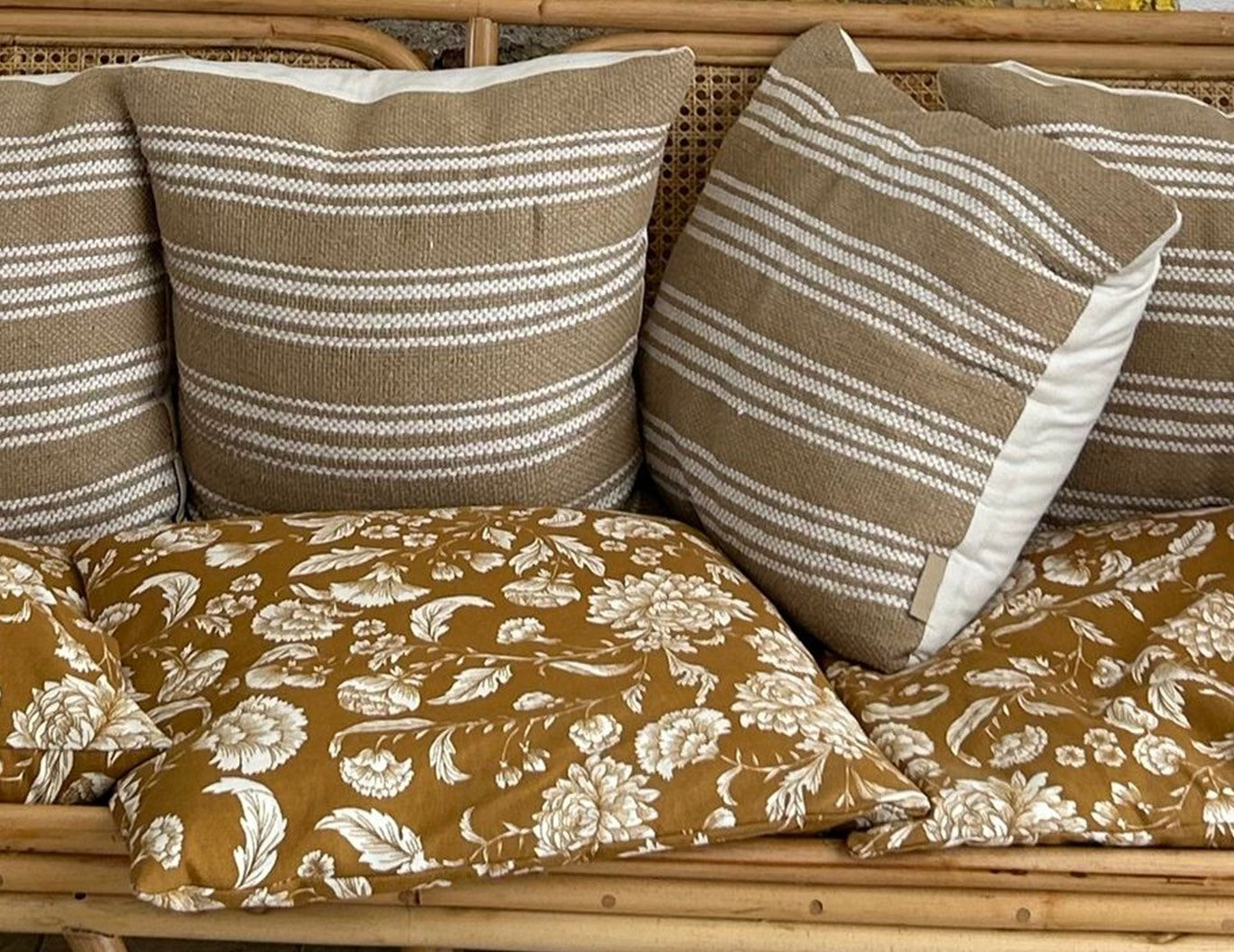 Close-up of the Arch sofa cushions and cane back
