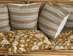 Close-up of the Arch sofa cushions and cane back