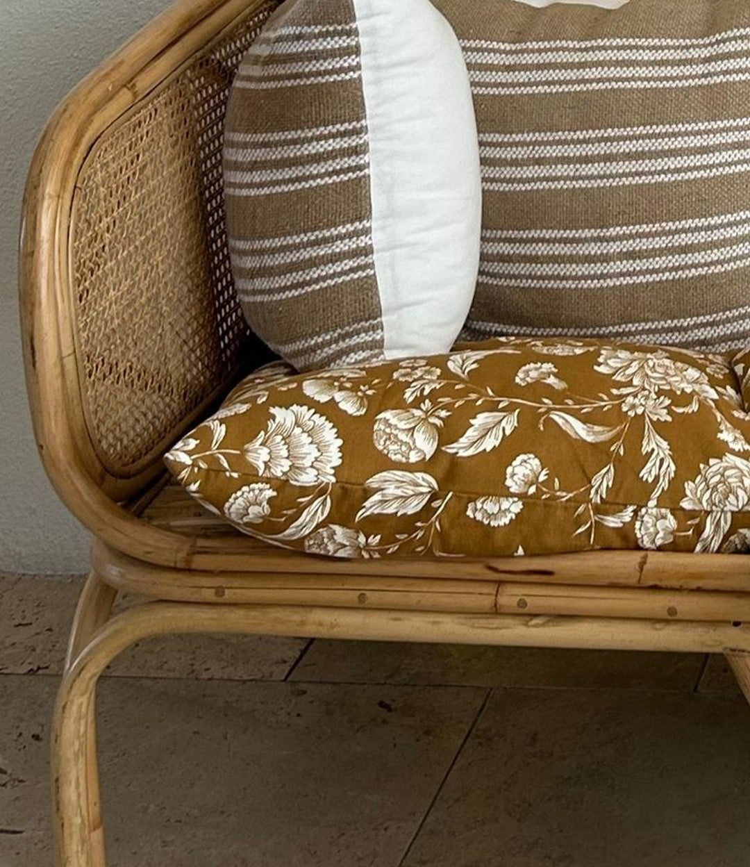Detail of the steam-bent rattan arm and woven back