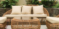 Nest rattan 3 seater sofa with cream cushions