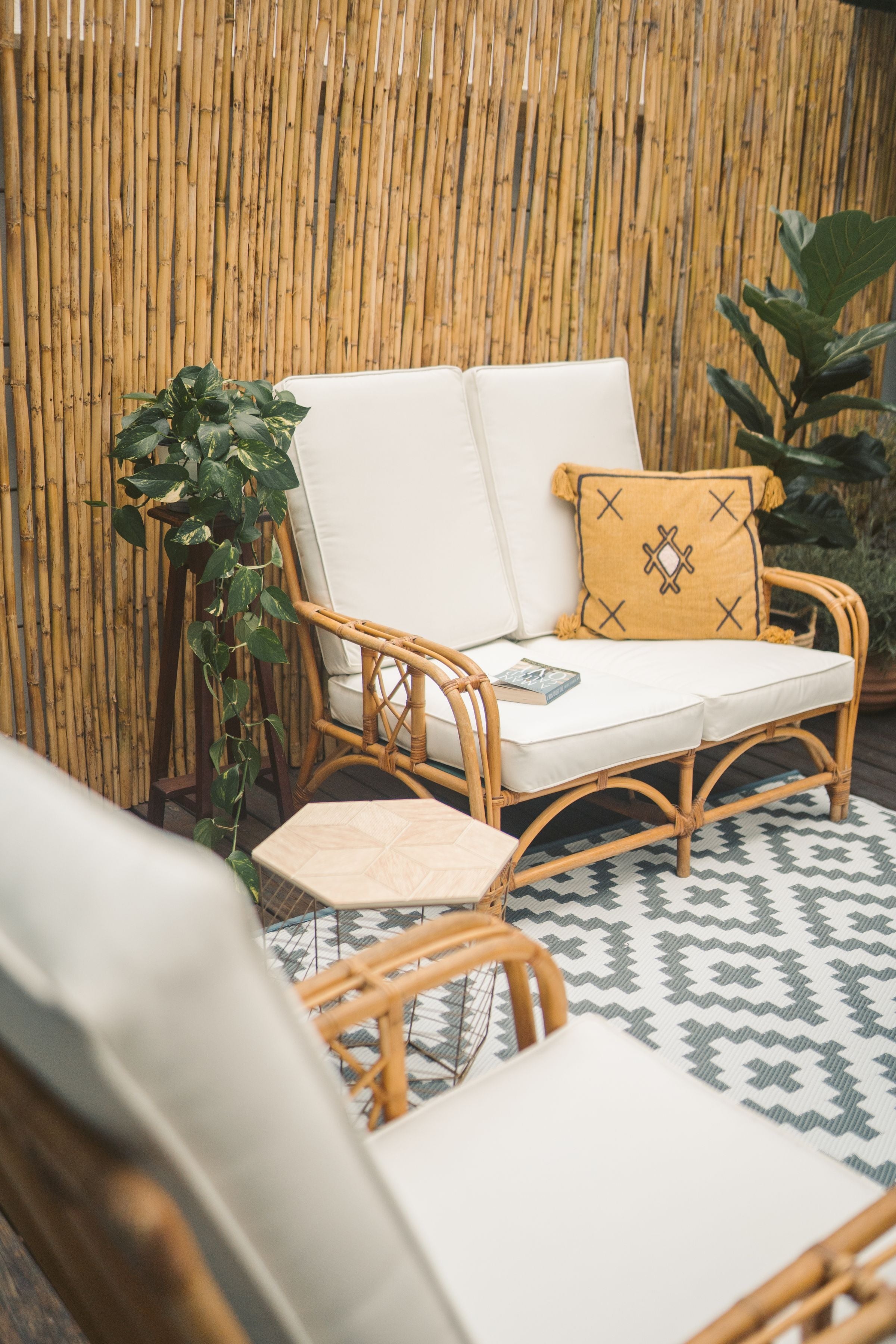 Riviera rattan loveseat, angled view