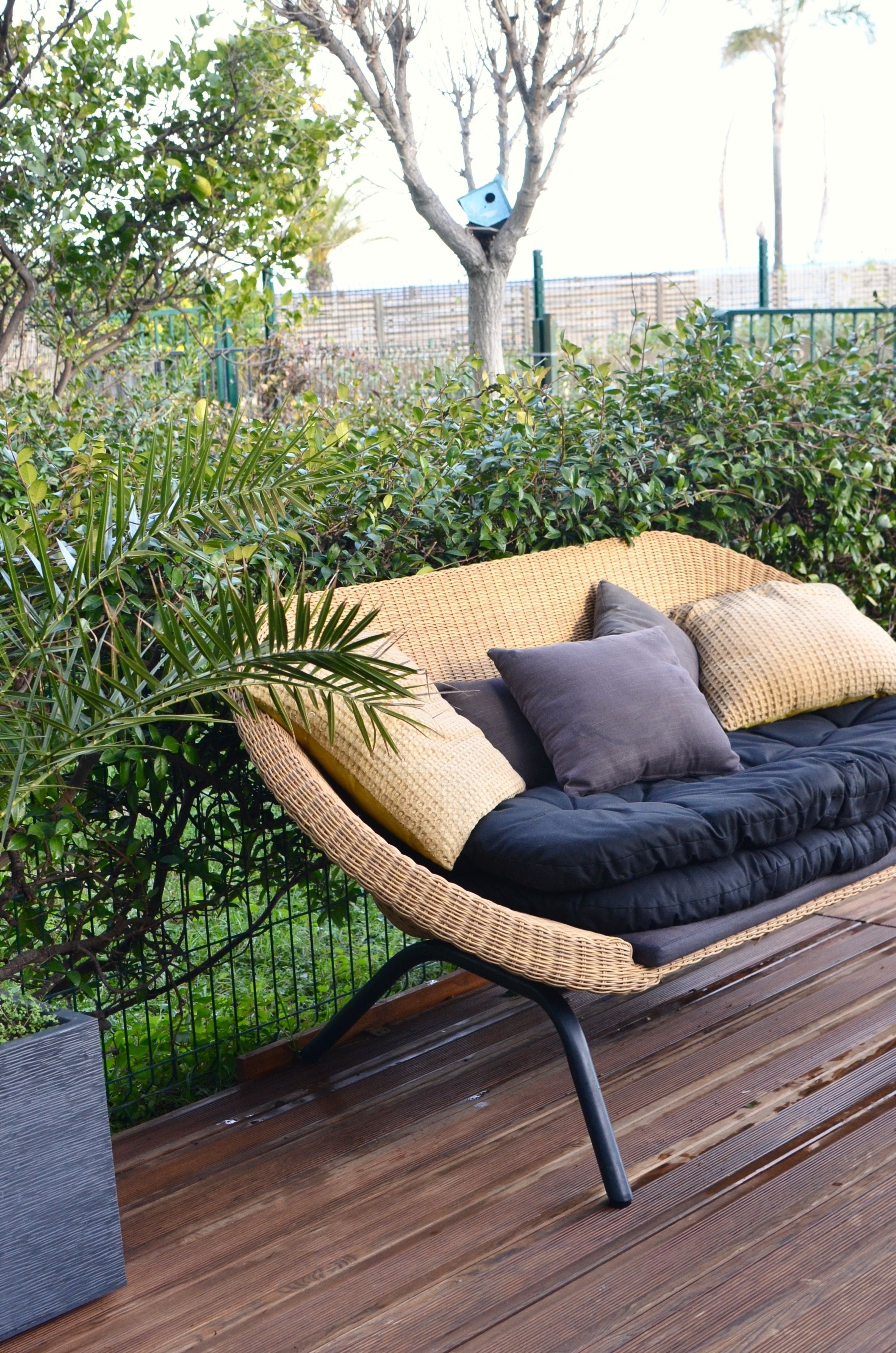 Solace rattan loveseat, front three-quarter view