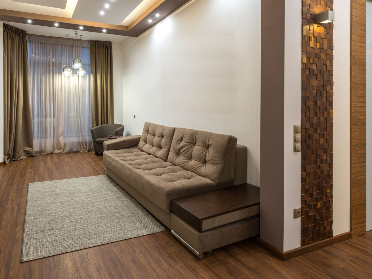 Sable camel tufted sofa cum bed with built-in wooden side table