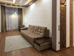 Sable camel tufted sofa cum bed with built-in wooden side table